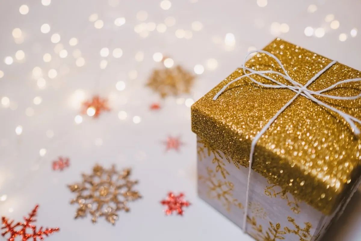 Christmas gift wrapped in Golden decorations