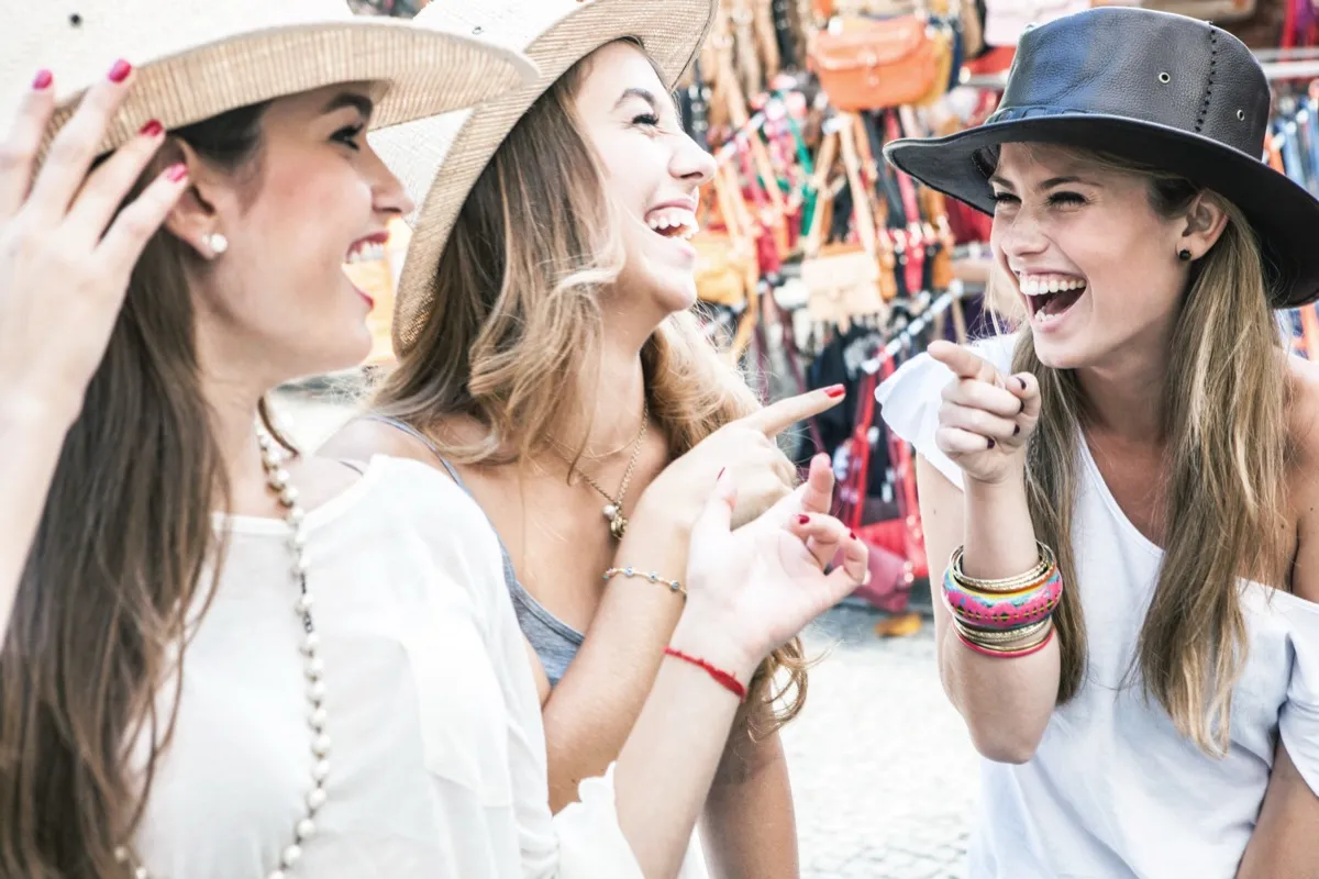 girls wearing hats having a great time