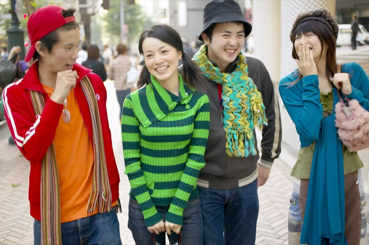 asian people walking and talking 
