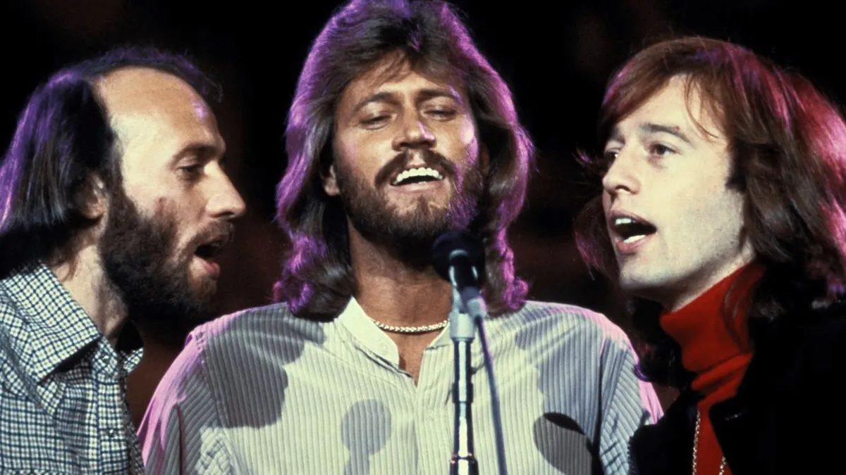 The Bee Gees singing on stage