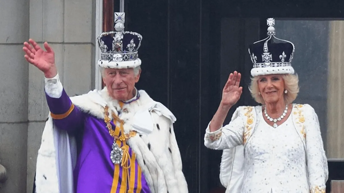 King Charles waving to people
